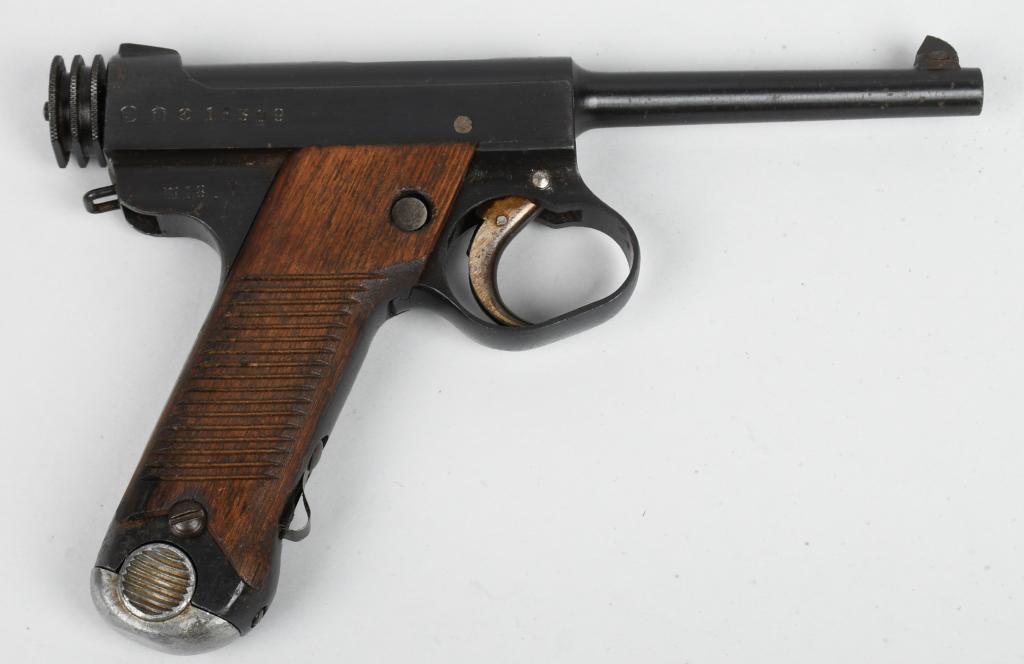 JAPANESE TYPE 14 NAMBU SEMI-AUTOMATIC PISTOL: Serial # 15309. Barrel length 4 1/2" , caliber 8mm nambu. This pistol made in 1943 at Nagoya arsenal (18.7). Standard mid-war issue with blue finish, straw colors, 17 groove mahogany grips, magazine n