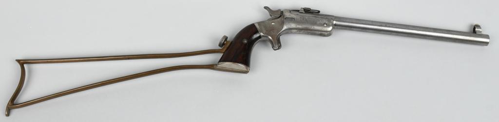STEVENS NEW MODEL POCKET RIFLE W/ STOCK: Serial #10098. Made from 1875-1896, 2nd issue with firing pin in frame. Has a 10" octagon to round barrel in .22 rim fire, globe front sight, folding long leaf rear sight, spur trigger, nickel plated 