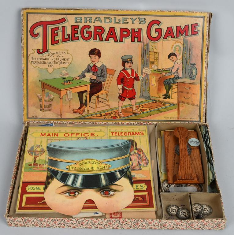 BRADLEY'S TELEGRAPH GAME: Excellent early game with wonderful box graphics. Looks to be all complete with mask and telegraph. Box has edge wear and som emissing edge flaps. 16" Very Good