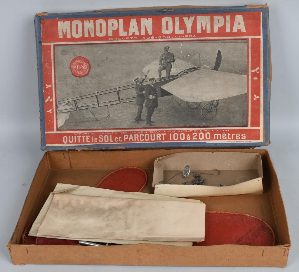 FRENCH MONOPLANE OLYMPIA AIRPLANE KIT: Very early Model Airplane Kit made in France. All original and complete with Pilot. Tin, Wood, and Cloth construction. Boxed 18" very Good