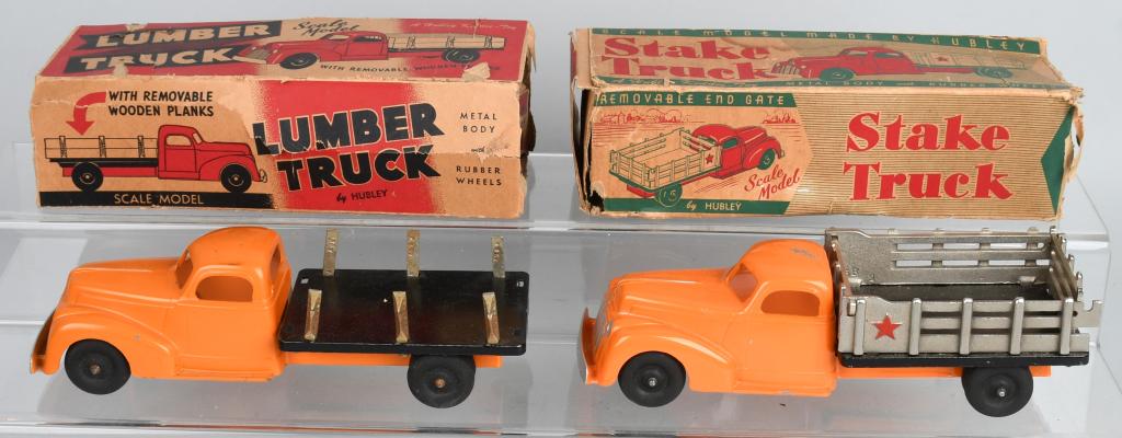2- HUBLEY TRUCKS w/ BOXES: Includes Lumber Truck and Stake Bed Truck. Both all original. Boxed. 9 1/2" Excellent