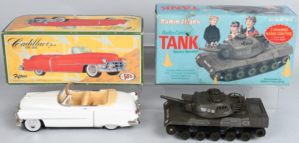 BATTERY OP TANK & FRICTION CADILLAC: Includes battery operated Tank and friction Cadillac Type 1950. Both Boxed. Largest 12" Excellent
