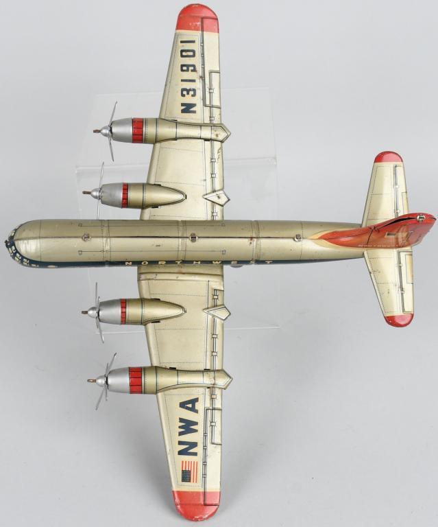 JAPAN TIN FRICTION NORTHWEST 4 PROP AIRPLANE: All original and complete. Friction works. 14" Wingspan. Excellent