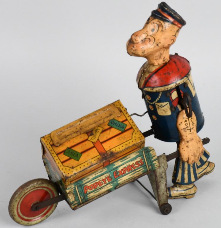 MARX TIN WINDUP POPEYE EXPRESS: All original. Scarce version with pop out parrot. Has wear. Missing pipe. 9" Good
