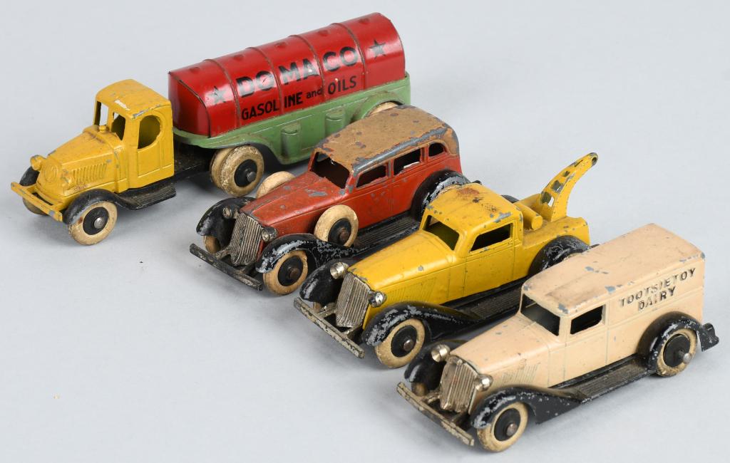 4- EARLY TOOTSIETOY GRAHAMS & MORE: Includes Graham Tow Truck, Sedan, and Ambulance. Plus Mack Domaco Gas & Oil Truck. Very Good