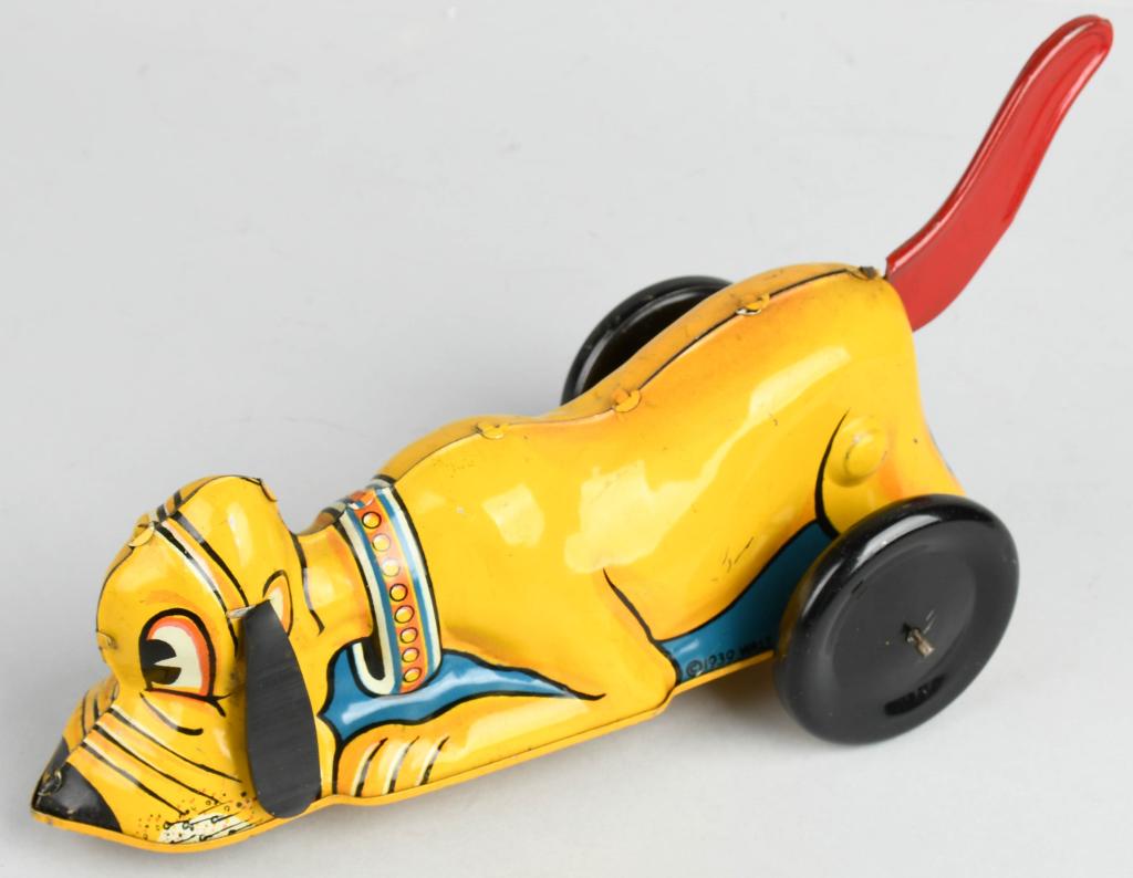 MARX TIN WINDUP PLUTO: All original with tail lever windup action. Great colors. 9 1/2" Excellent
