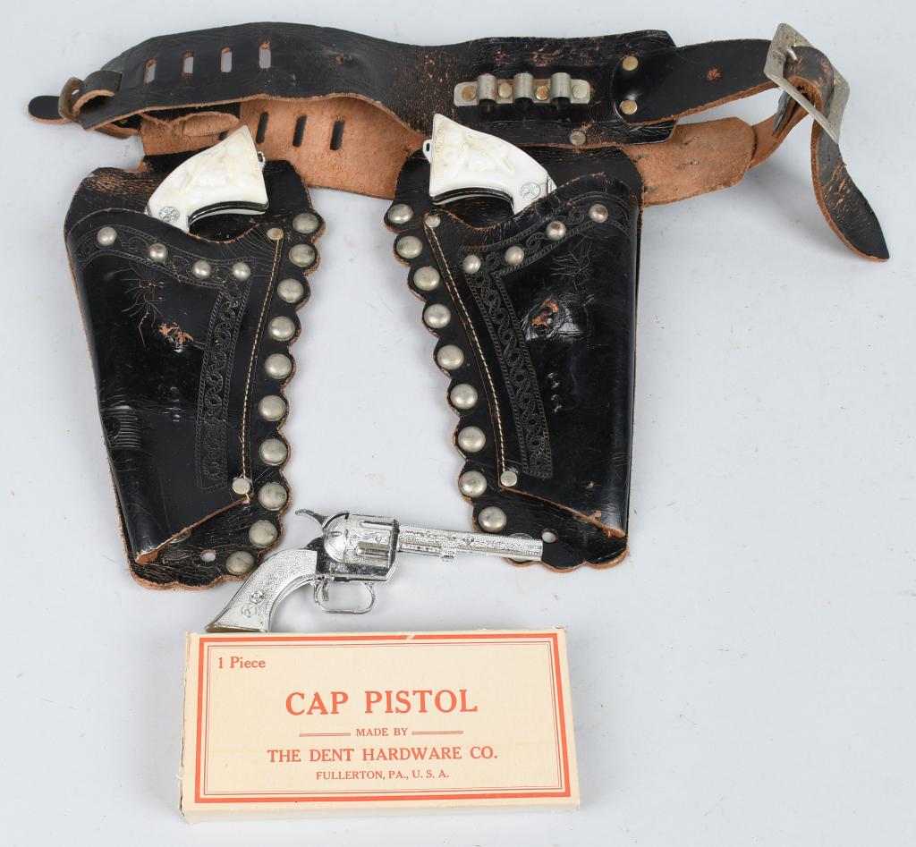 KILGORE KIT CARSON DOUBLE HOLSTER SET & MORE: The Kilgore Kit Carson set has one gun that works and the other that works sporadically. The one holster is detached from the belt. Also included is a Dent Cap Pistol box, with an incorrect Kilgore "P