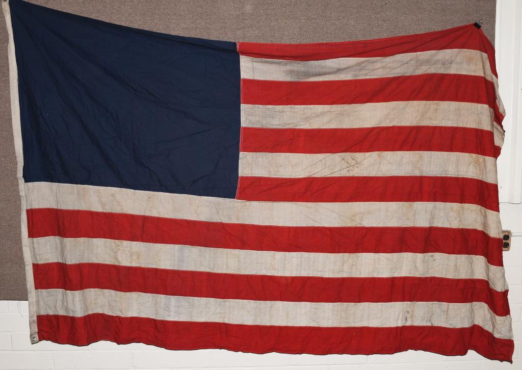 6 UNFINISHED US FLAGS WITHOUT STARS: 6 Vintage American Flags, each one has 13 red and white stripes, and a blue field, but none have had their stars printed or embroidered on. Unclear whether these are unfinished from the factory or whe
