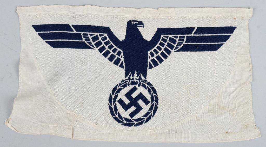 WWII NAZI GERMAN HEER SPORT SHIRT CHEST PATCH: Chest eagle patch for t he Nazi Army / Heer athletic sports shirt. Black left-facing eagle over mobile swastika on field of white, bevo style construction. Measures approximately 10.5" across, approxi