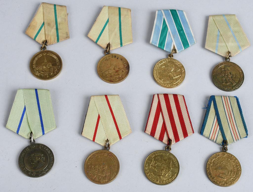 8 WWII SOVIET RUSSIAN DEFENSIVE CAMPAIGN MEDALS: Set of 8 World War II era Soviet Russian medals for defensive operations during World War II. They include 2 Defense of Leningrad Medals, Defense of Odessa, Defense of Sevastapol, Defense of Stalingra
