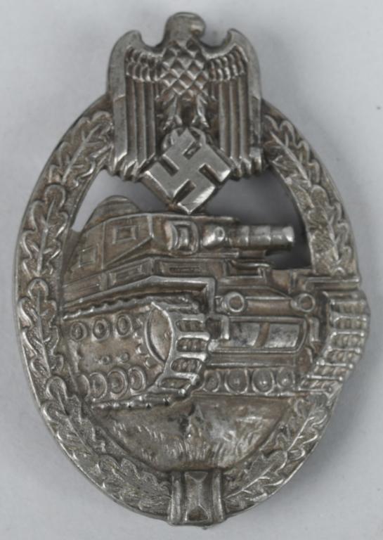 WWII GERMAN NAZI SILVER PANZER ASSAULT BADGE AWS: Die forged alloy construction, partially scooped backed, badge with a silver washed finish features a vertically oval oak-leaf wreath with a Wehrmacht style eagle with down-swept wings, superimpose to