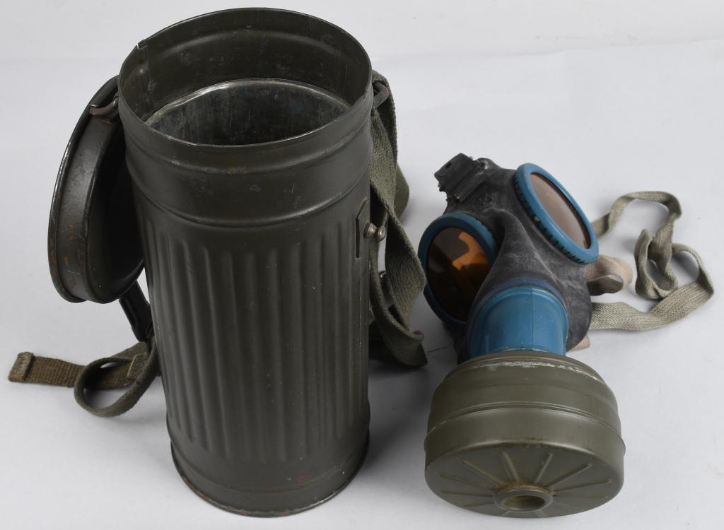 WWII NAZI GERMAN M30 GASMASK & CANISTER 1941 DATE: M30 pattern cloth covered rubberized canvas gas mask. Mask is complete with all straps. Mask is size marked 3. Included is a "FE" 41 dated sealed filter. The mask comes housed in a second pattern M30/