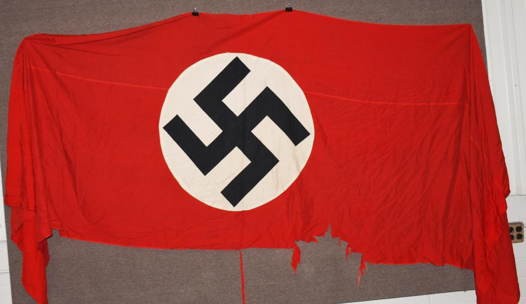 WWII NAZI GERMAN NSDAP WALL BANNER OR LARGE FLAG: Large multi-piece cotton construction banner approximately 48 x 150 inches. To both its red fields are sewn an 80cm diameter white disks, with a printed mobile swastikas in black. Original bunting sti