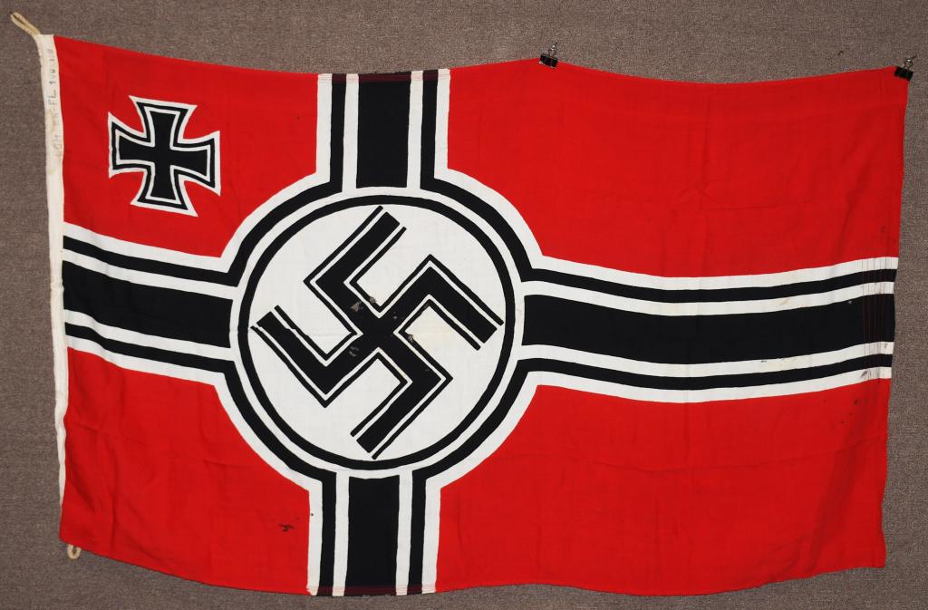 WWII NAZI GERMAN KRIEGSMARINE NATIONAL FLAG: Second pattern (Circa 1937/38-1945) single piece dual sided printed cotton/linen construction national war flag. The flag features a red base field with a central white/black/white/black bordered whit