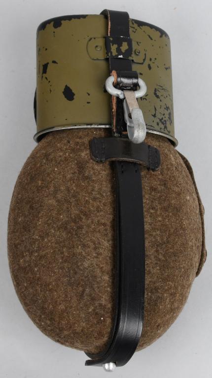 WWII NAZI GERMAN M40 CANTEEN AND CUP: Aluminum flask style WWII German canteen marked "P. Pr. Bln" at the throat of the canteen, in wool carrier case, with 4-snap closure, stamped "40" on the inside of the cover snap backing. Black-side-o