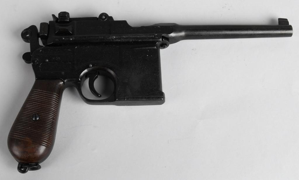 REPLICA WWII GERMAN BROOMHANDLE MAUSER PISTOL: Cast replica of the iconic WWI & WWII German Broomhandle Mauser pistol. Barrel is plugged with orange filling. Good reenactment or display replica - can be cocked and fired and has adjustable sight an