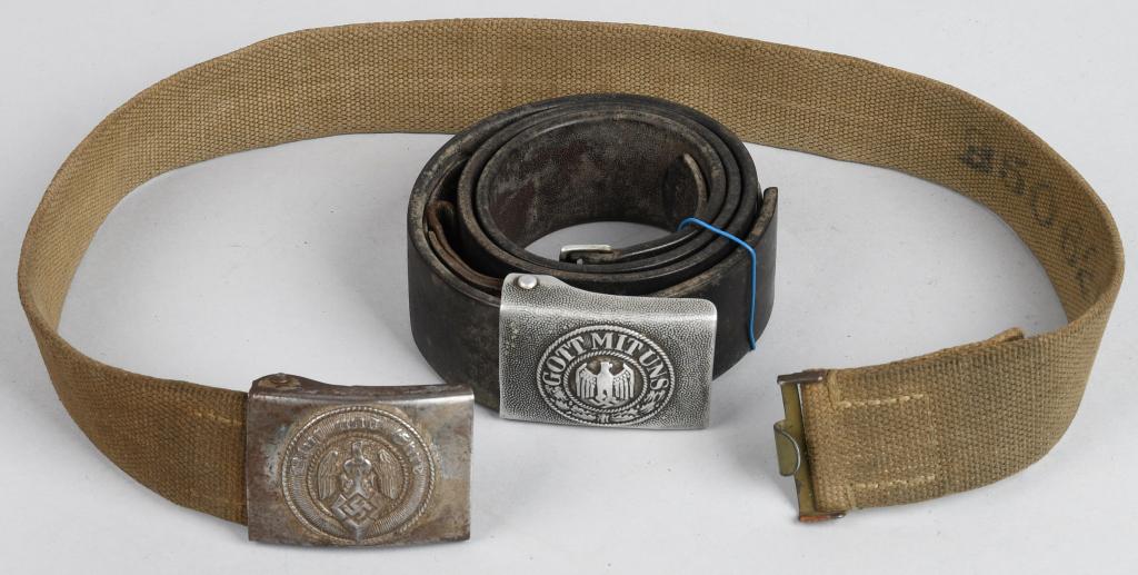WWII NAZI GERMAN ARMY BELTS AND BUCKLES: 1) Pebbled aluminum buckle with "Gott Mit Uns" crest and German eagle over mobile swastika. Attached to smooth leather belt with silver buckle. Belt is marked "G. Reise 1938" near the end. 2) Pebbled 