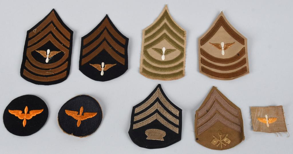 U8 PREWAR AIR CORPS, SIGNALS RANK INSIGNIA: Lot of 8 pre-World War II patches, including 4 specialist Army Air Corps enlisted rank chevrons for Specialist-6, Sergeant, and Master Sergeant all four of which have the wing and prop insignia embroi