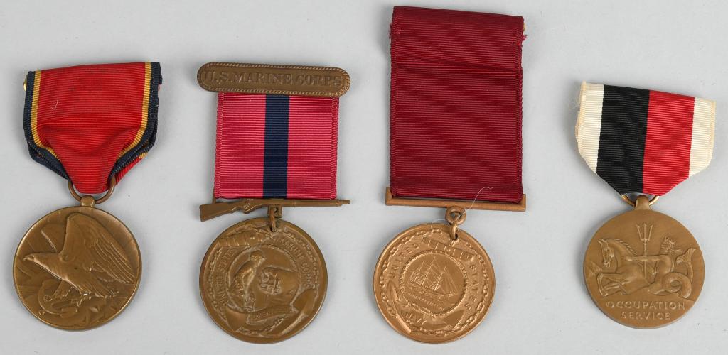 WWII US NAVY AND MARINE CORPS MEDALS NAMED: WWII era Navy and Marine Corps medals including a named Good Conduct medal awarded to Pete Nick Evkovich in 1946 for service which spanned the war, Also includes post-war Occupation medal with navy pl