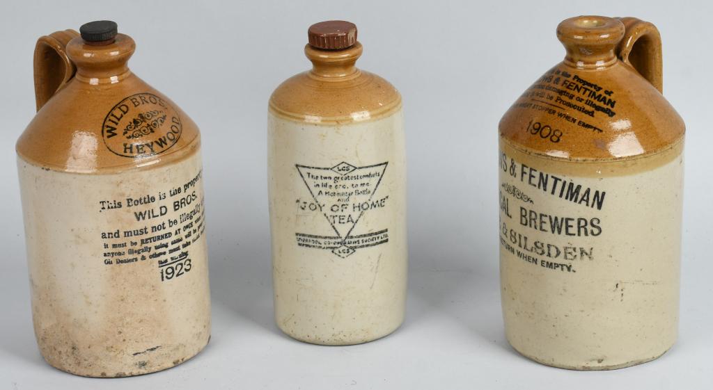 3- STONEWARE ADVERTISING JUGS: Lot includes 1923 Wild Bros, 1908 Hollows and Fentiman, along with Joy of Home Tea. Largest is 11", Hollows jug has hairline cracks. Condition varies, overall, Very Good