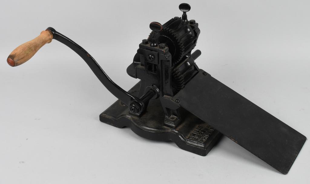 1870s T MILLS BROS. TAFFY CANDY CUTTER: Scarce 1870s T Mills Bros. Philadelphia Taffy Cutter. Cast iron construction. Has sheet for candy attached. 24"x12"