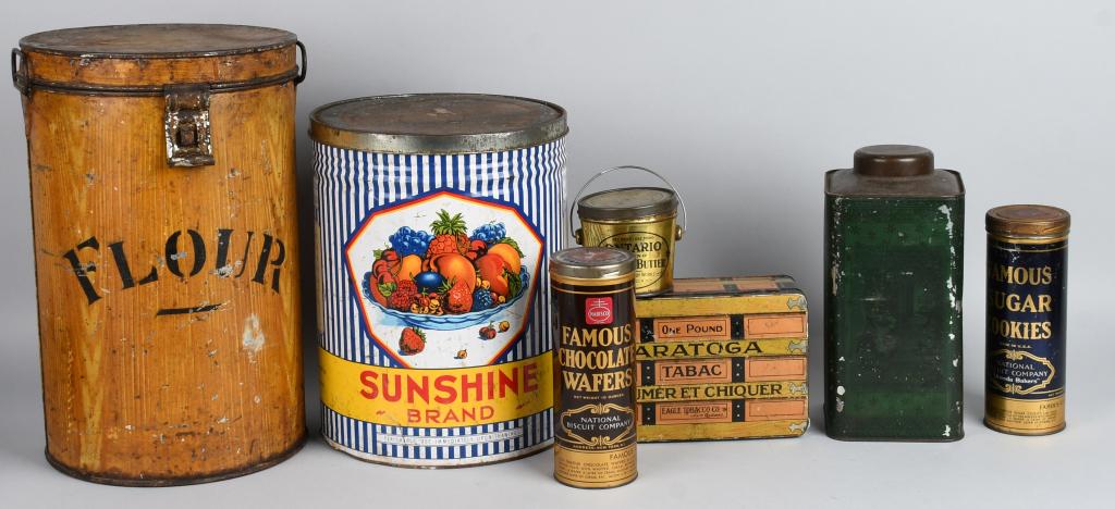 Lot of Misc. Tins: Includes Ontarion Peanut Butter, Saratoga Tobacco, John H Mann Tea, Sunshine Brand, Flour, Famous Chocolate Wafers, and Famous Sugar Cookies. Largest 5 gallons. Very Good-Excellent