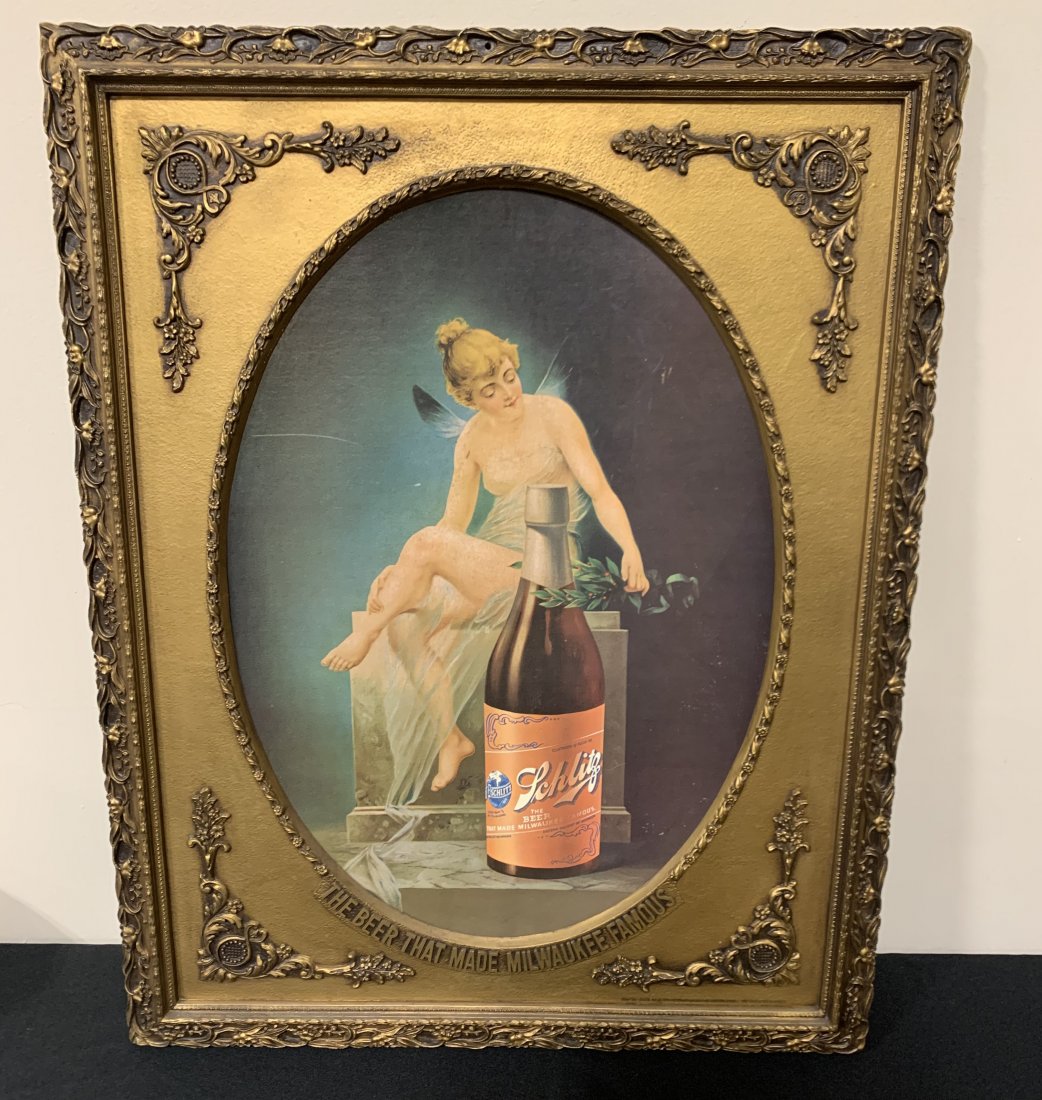 Schlitz "The Beer that made Milwaukee Famous" Sign: rated 8.5, 28"x22", cardboard poster in a ornate plastic embossed framed, has very good color, has light wear to the poster, marked part number 84744