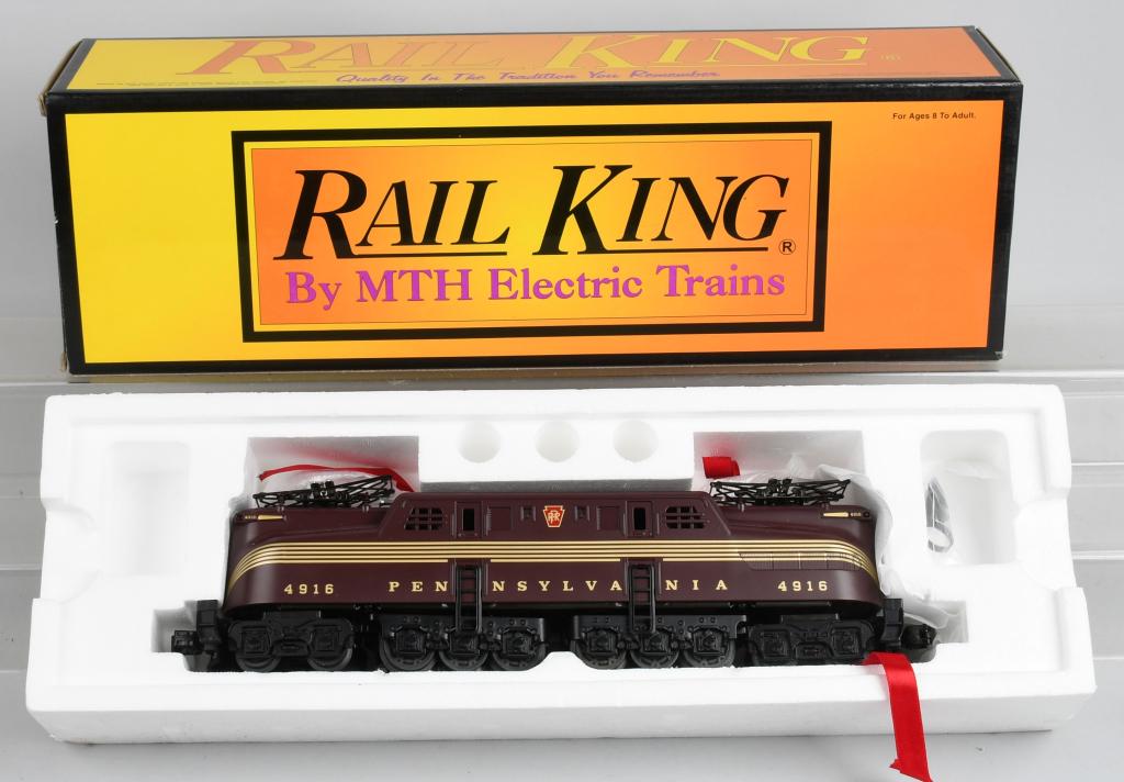 BOXED MTH ELECTRIC GG-1 ENGINE: Item no. 30-2507. This is a five stripe , red GG-1 O-gauge engine. Famous newly made rendition of the Tuscan Red Pennsylvania engine that is as new in it's original box with instructions.