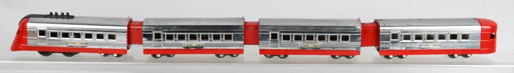 PRE-WAR LIONEL JR. STREAMLINER TRAIN SET: This four car set includes the engine and three cars with vestibules. It is an O-gauge electric with red and chrome color scheme. The engine has a complete stack with no warpage. The original red pain