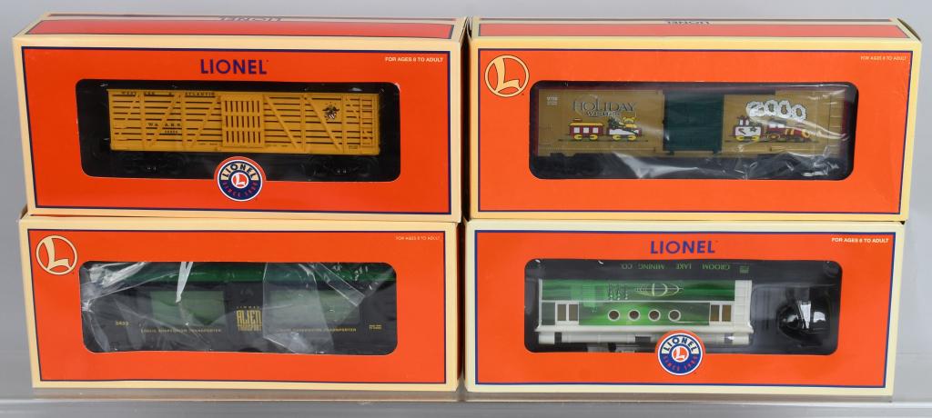 LOT OF (4) BOXED LIONEL SPECIALTY ROLLING STOCK: A. 2000 Christmas Box Car No. 6-26272 B. Sheriff & Outlaw Box Car No. 6-36856 C. Alien Transport Aquarium Car No. 6-19869 D. Alien Security Car No. 6-36863 All are O-gauge and as new in original boxes