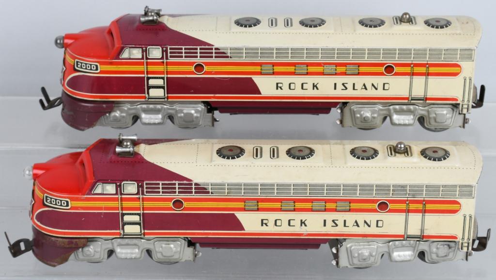 UNIQUE ART ROCK ISLAND DIESEL TIN PLATE SET: Scarce tin plate electric Rock Island diesel engine with dummy engine. Really clean tin plate litho free of dents or rust with just a few minor areas of handling, play wear and a few minor stains. A g