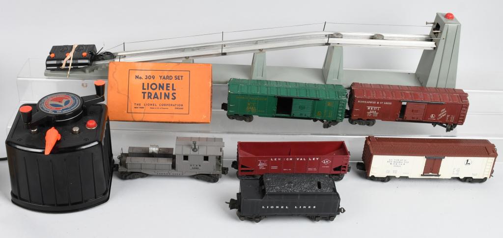 LIONEL MISC LOT: Lot includes 456 coal pumper with control, 6464 Minneapolis & St Louis box car, 022 switch controllers, 6456 red hopper, 36621 operating milk car with cans, 2420 work caboose, 6464 rock island box car