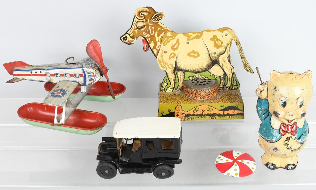 MARX PORKY PIG & MORE: Includes Marx Porky Pig working with loose umbrella, Chein Seaplane, Mooing Cow, and Old Timer Car. Largest 9" Very Good