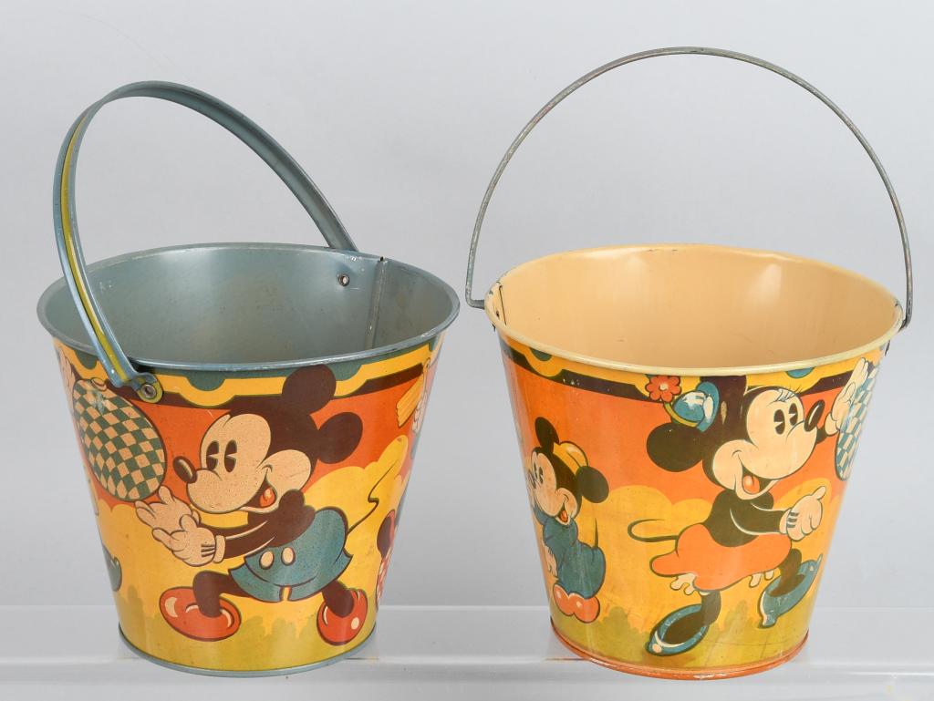 2- 1930'S MICKEY & MINNIE MOUSE SAND PAILS: The sand pails are new old store stock and have great graphics. Some storage rubs. Made by Happnak England. 6" high with 7" diameter. Excellent