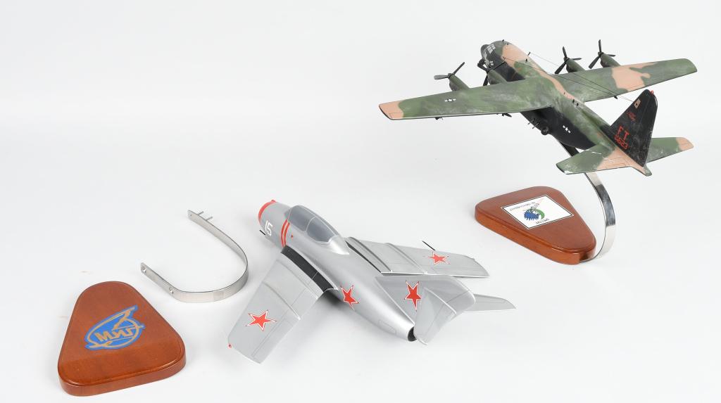 MIG-15 & AC-130 AIRPLANE DESK MODELS: Includes MIG-15 Fagot and AC-130 Hercules Gun Ship Airplane Desk Models. Both carved wood. Like new with Box. 15" Near Mint