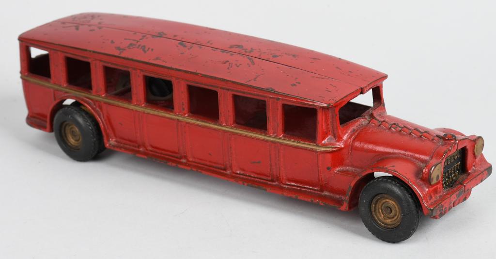 ARCADE 1920'S cast iron LARGE SIZE FAEGOL BUS: Impressive cast iron Faegol bus measuring 121/4". All original red paint with gold striping. No cracks or breaks. Two of the original rubber tires are chipped. No driver. A great example of this toy.