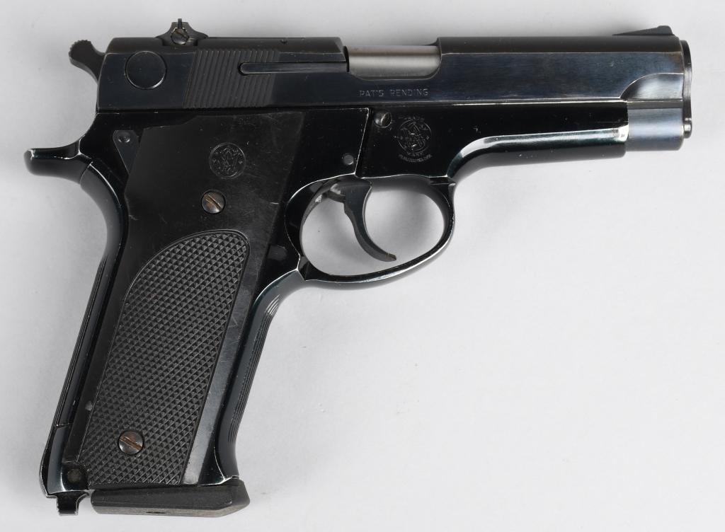 SMITH & WESSON MODEL 59 SEMI-AUTOMATIC PISTOL: Serial #A368649. Barrel length 4". Caliber 9mm. Made in 1976-77. Standard blue semi-automatic pistol that features an alloy frame, black plastic grips, steel slide, adjustable rear sight and one magaz