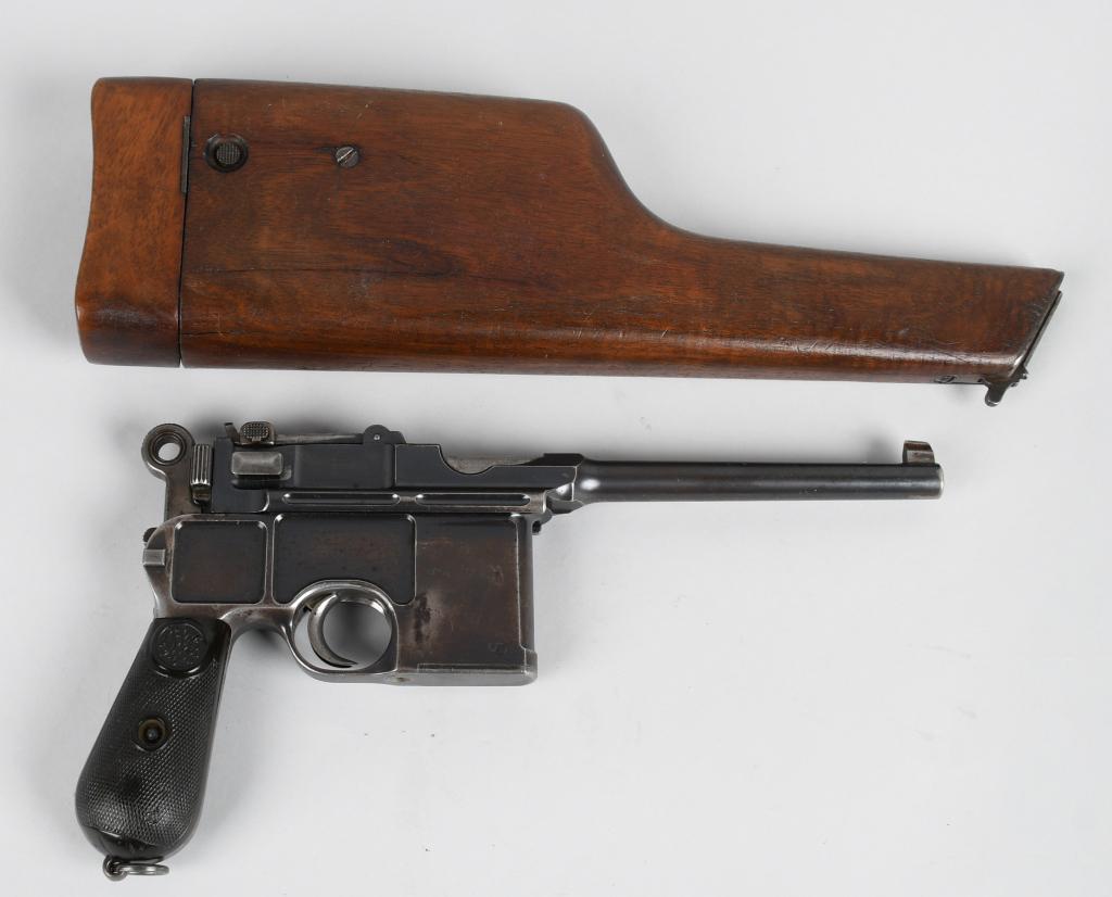 LATE TRANSITIONAL LARGE RING MAUSER BROOMHANDLE: Serial #14702. Barrel length 5.5". Caliber 7.63. This is a very early large ring C-96 semi-automatic pistol with early 500 meter rear sight. All matching numbers. Other features include the monogram g