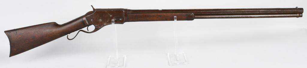 WHITNEYVILLE KENNEDY LEVER ACTION RIFLE: Serial #945. Barrel length 28". Caliber .44. Made from 1879-1886. This is an unusual rifle in that it is a large heavy frame with a 28" full octagon barrel and magazine but is stamped .44 CF. Accordin
