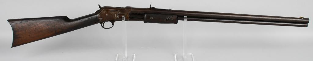 ANTIQUE COLT LIGHTNING SLIDE ACTION RIFLE: Serial #12042. Barrel length 26". Caliber .32-20. Made in 1885. This is an early second year production open top rifle that features a full round barrel, full magazine, German silver front sight, semi