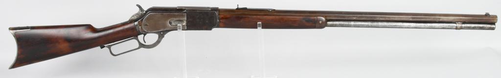 WINCHESTER MODEL 1876 LEVER ACTION RIFLE: Serial #49030. Barrel length 28". Caliber 45-75. Made in 1884. Standard rifle features a full octagon barrel, full magazine, bead front sight, long tang flat top sporting sight, blue finish, walnut st