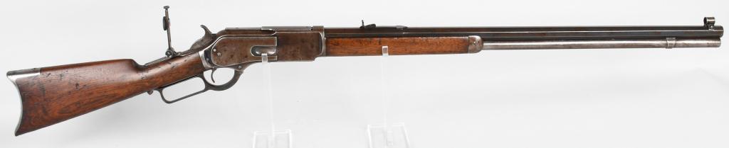 FINE WINCHESTER MODEL 1876 LEVER ACTION RIFLE: Serial #17099. Length 28". Caliber 45-60. Made in 1881. This standard rifle features a full octagon barrel, full magazine, a Winchester Mid-Range graduated peep sight, globe front sight, Winchester se