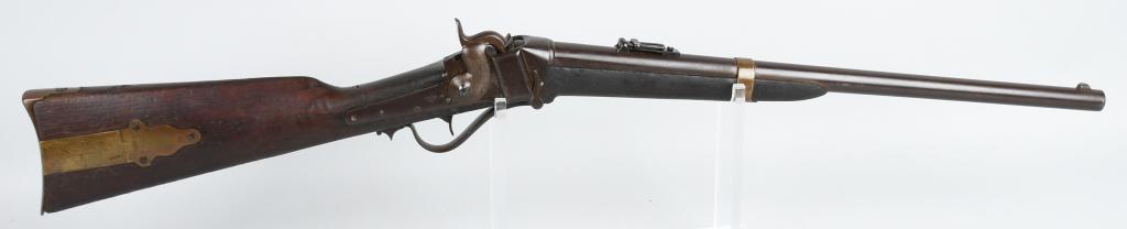 SHARPS MODEL 1853 SLANT BREECH CARBINE: Serial #23445. Barrel length 21.5". Caliber .52. Made 1854-1857. This model referred to as the slant breech. Features round barrel, brass barrel band, patch box and butt-plate. Lock dated 1852. Sharps