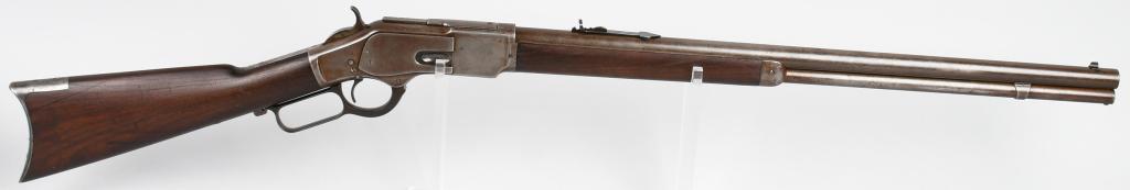 FINE WINCHESTER MODEL 1873 LEVER ACTION RIFLE: Serial #77424. Barrel length 24" . Caliber .44-40. Made in 1881. A super clean all original rifle that features a full round barrel, full magazine, replaced bead front, replaced semi-buckhorn rear sig