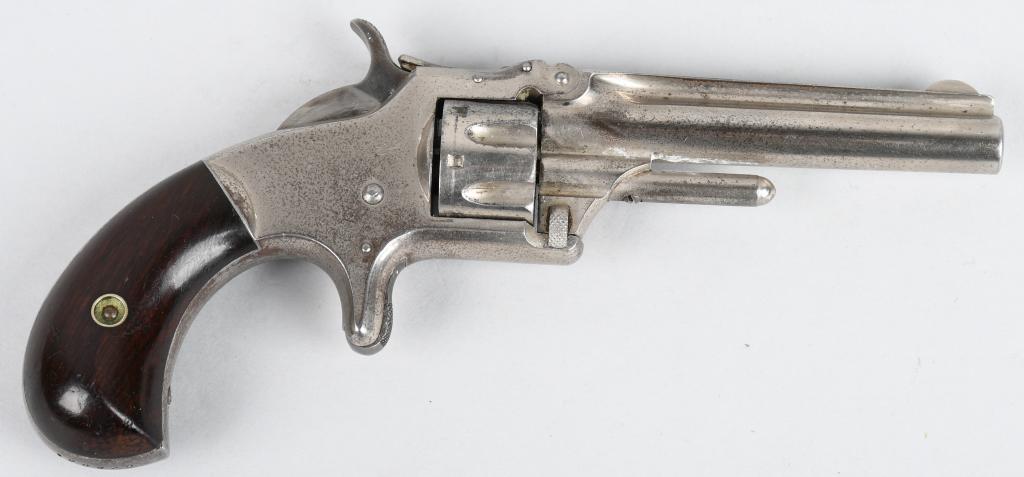 SMITH & WESSON MODEL NO. 1 3RD ISSUE .22: Serial #106886. Barrel length 3". Caliber .22 Rimfire short. Made 1868-1881. This post Civil war era pocket revolver features factory nickel finish, birds head rosewood grips, 7-shot single action, sp