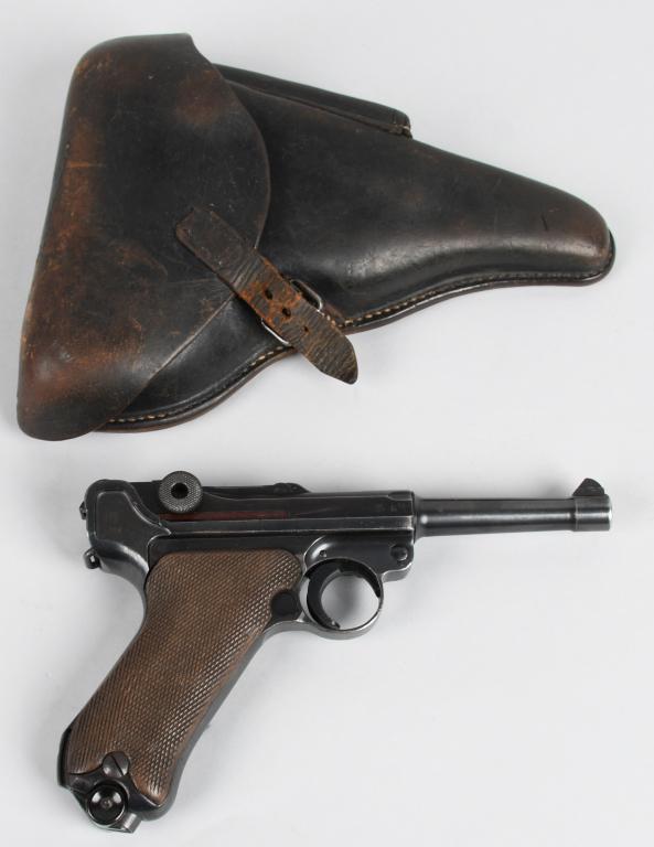 1934 CODE byf 41 DATED LUGER PISTOL: Serial #9711. Barrel length 4". Caliber 9mm. Manufactured at Mauser plant for German army military sales. Stamped P-08 on left side of frame and has stock lug. All matching numbers but checkered walnu