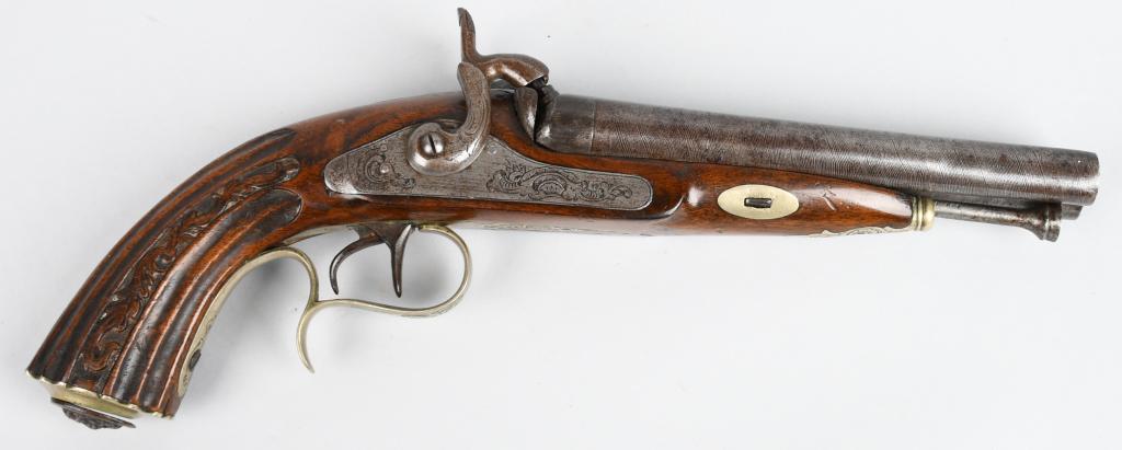 LOVELY DOUBLE BARREL PERCUSSION PISTOL: Barrel length 6.5" Bore .60. Unmarked but most likely French or Prussian. Features damascus barrels in the white, engraved double side plates and hammers. Silver plated and engraved decorative brass t