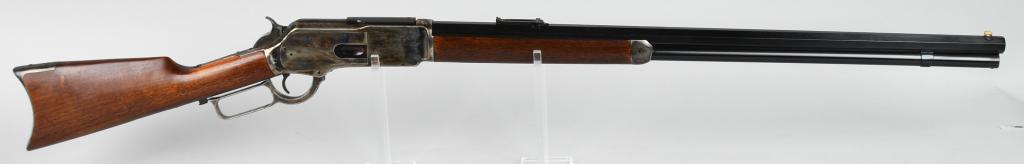 CHAPARRAL WINCHESTER MODEL 1876 LEVER ACTION: Serial #W760709. Barrel length 28". Caliber .45-75. This gun features a full octagon barrel, full magazine, folding ladder rear sight, blade front sight, walnut stocks, with blue and case color finish