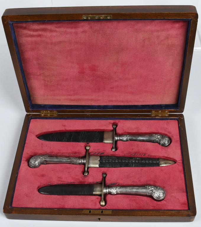 RARE CASED SET (3) IXL WOSTENHOLM BOWIE KNIVES: The three knives come in a wooden period box with brass plaque with makers name and IXL. The cased is lined in faded red velvet and inside are three matching IXL stamped spear point bowie knives with