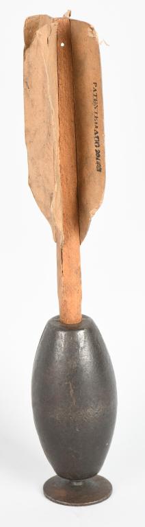 CIVIL WAR KETCHUM GRENADE w ORIGINAL FINS INERT: Original Civil War Ketchum Grenade. Tapered, oval-shaped iron- grenade, 5 1/4” long, 2 1/2” wide at its mid-section. The tail is about 8 1/2" and has heavy paper fins. One fin is marked Patented A